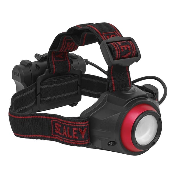 Sealey rechargeable head torch with adjustable strap and red detailing, designed for hands-free lighting in various environments.