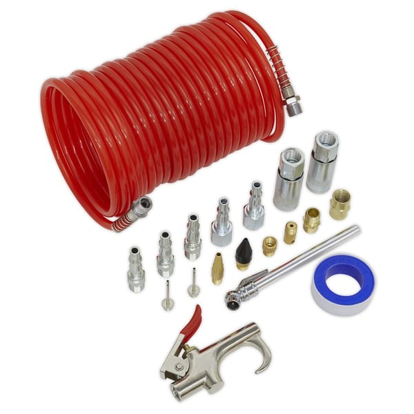 Red air hose coil with various fittings and accessories including connectors, nozzles, and a blow gun for pneumatic applications.