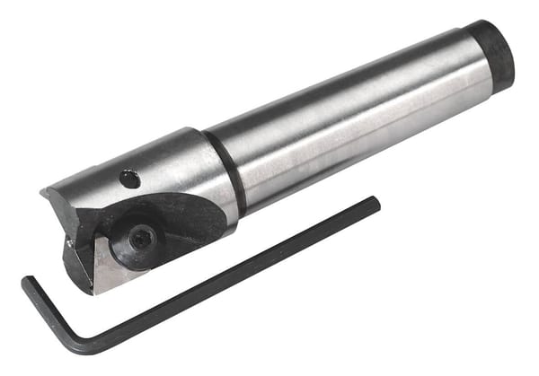 Precision cutting tool featuring a cylindrical body and a cutting edge, accompanied by an Allen key for adjustments, ideal for machining tasks.