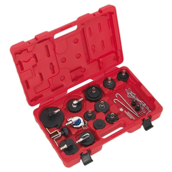 Red tool kit containing various automotive repair tools and components, including caps, clips, and fittings for efficient repairs.