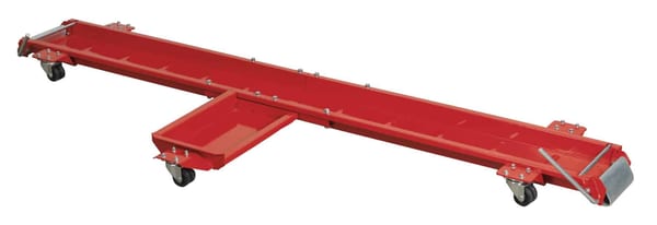 Red motorcycle dolly with side stand, perfect for garage use and bike maintenance.