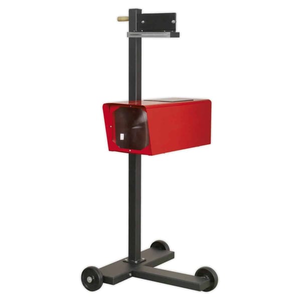 Compact headlamp beam setter for precise vehicle light alignment.