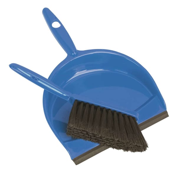 Blue dustpan and brush set, perfect for indoor cleaning tasks.