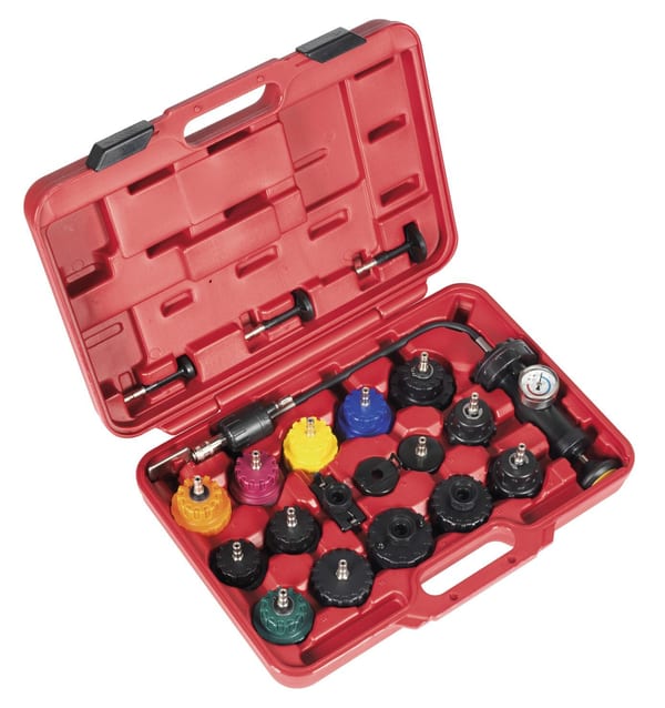 Cooling system tester cap kit in red case for vehicle servicing