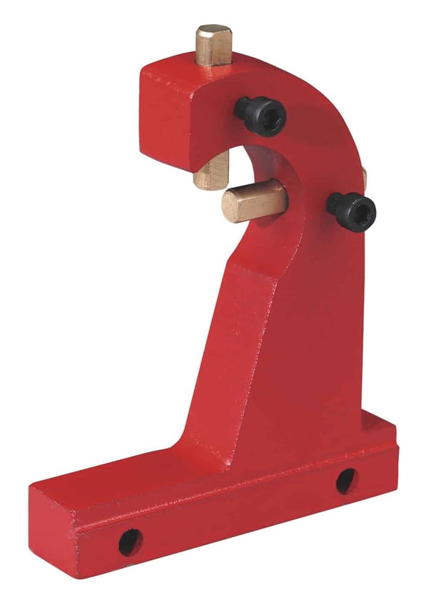 Red metal tool holder designed for workshop applications, featuring adjustable components for secure tool placement.