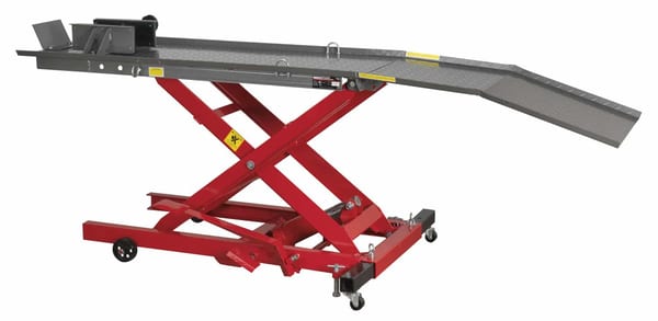 Heavy-duty scissor lift table with adjustable height and loading ramp for efficient material handling and automotive repairs.