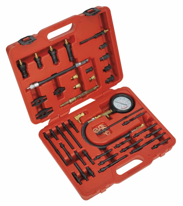 Master compression test kit for petrol and diesel engines with various gauges and adapters.
