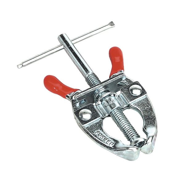 Battery terminal puller tool for vehicle service, featuring red rubber grips.
