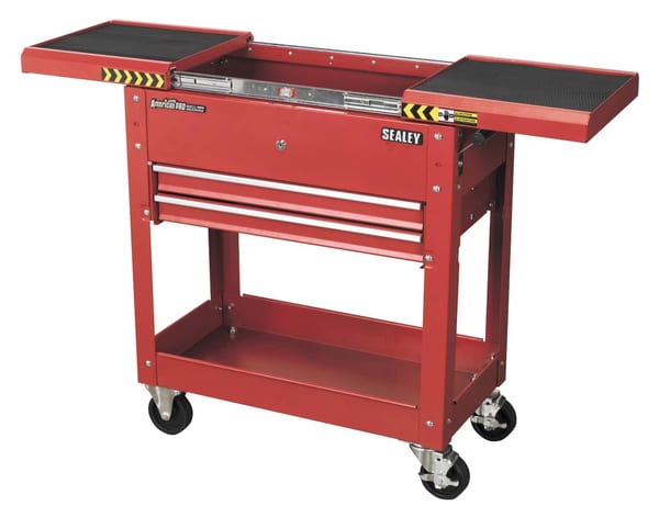 Red mobile tool and parts trolley with open drawers and wheels for easy mobility