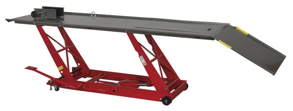 Hydraulic motorcycle lift with 454kg capacity, designed for garage use.