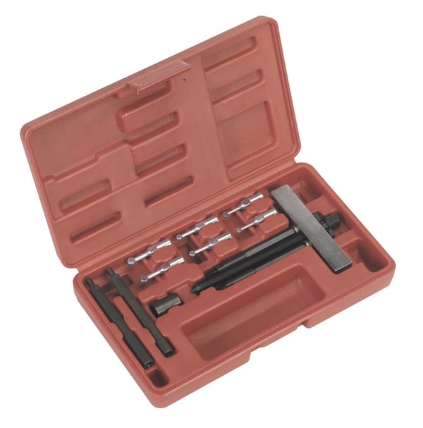 Blind bearing removal tool kit in a red storage case for vehicle service and workshop tasks.