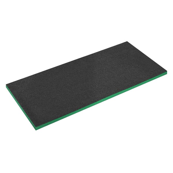 Black foam exercise mat featuring a green edge, suitable for various fitness activities and workouts.