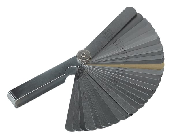 Feeler Gauge with 32 dual marked stainless steel blades for precise measurements.