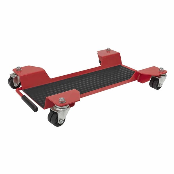 Heavy-duty mechanic's creeper with four wheels and a sturdy platform for easy mobility under vehicles.
