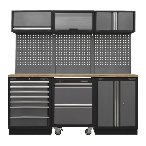 Heavy-duty garage workbench with multiple storage options, including drawers, cabinets, and pegboard for tools and accessories.