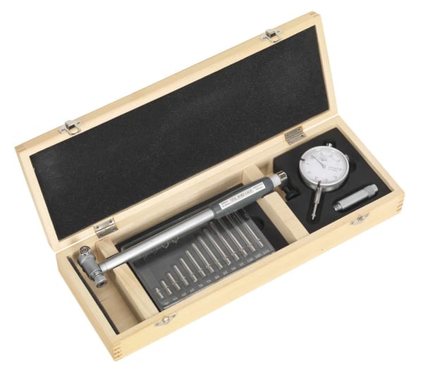 Dial Bore Gauge set in a wooden box for precise engine measurements.