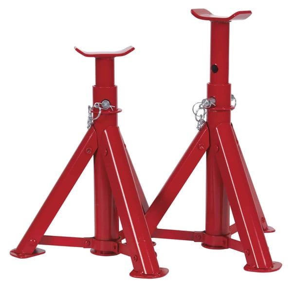 Red axle stands with a 2-tonne capacity per stand and folding design for garage use.